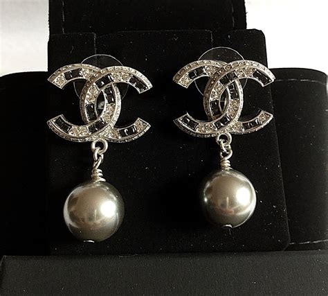 black chanel earrings price|vintage Chanel pearl drop earrings.